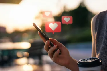 Close-up of a woman's hand using a mobile phone