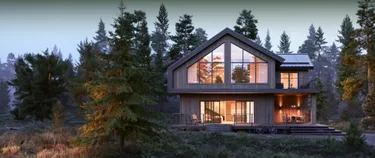 Erleuchtetes modernes Haus im Wald