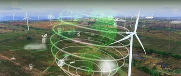 Eine Landschaft mit Windräder über der eine transparente Weltkugel projiziert ist. 