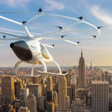 Flugtaxi: Das Bild zeigt eine Konzeptzeichnung eines Volocopter-Protytypen, der über New York fliegt