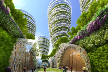 Dieses Bild zeigt eine Animation einer smarten Stadt. Hier sind große Gebäude zu sehen, umgeben von viel Grünflächen.